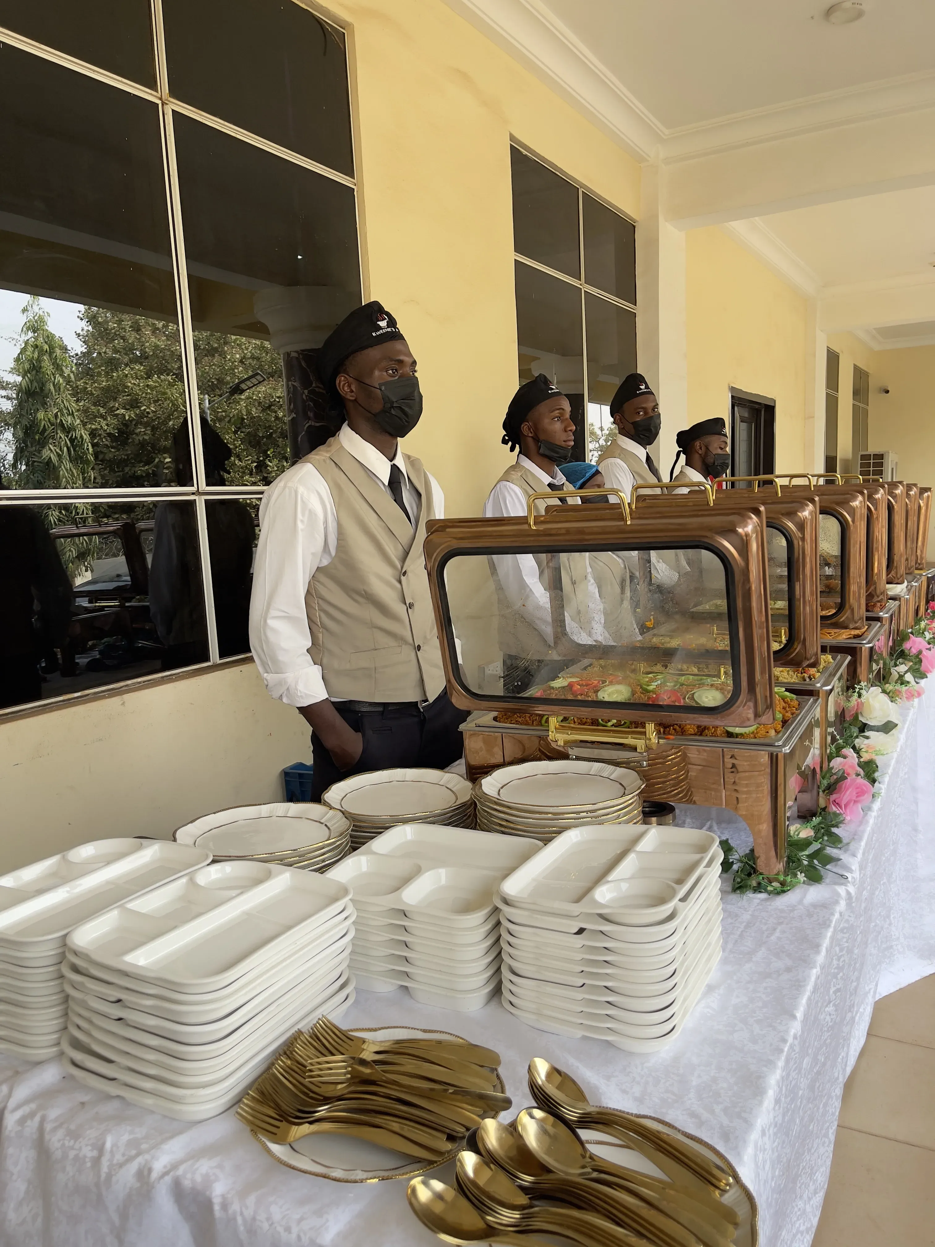 Catering team at a formal event with elegant place settings