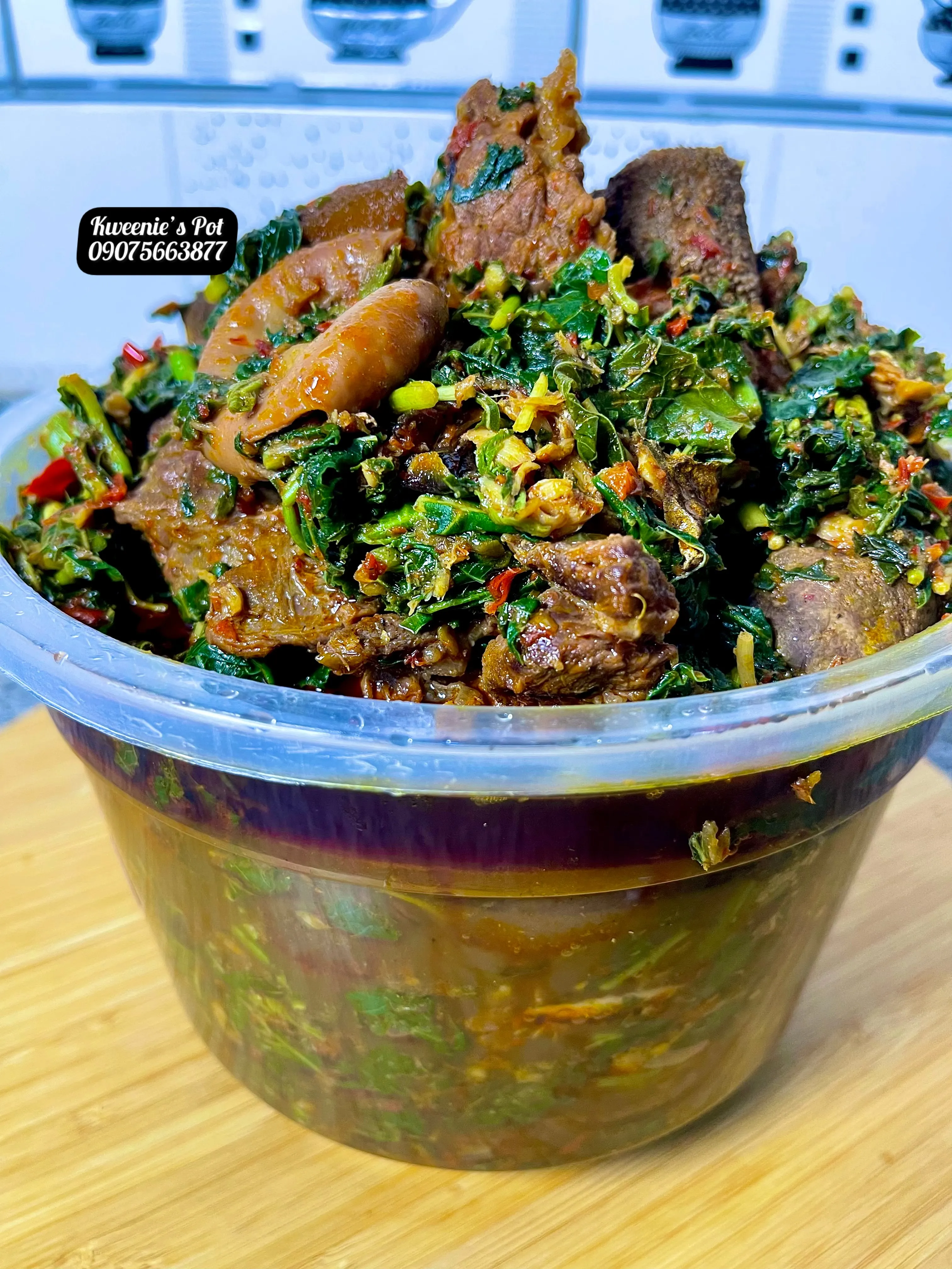 Efo riro vegetable stew loaded with assorted meat, peppers, and locust beans
